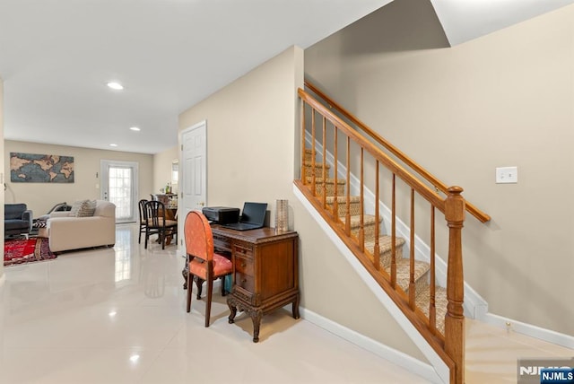 interior space featuring recessed lighting and baseboards