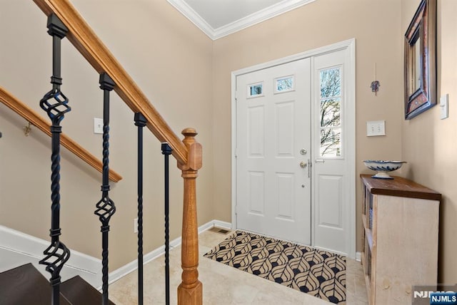 foyer with tile patterned floors, stairway, baseboards, and ornamental molding