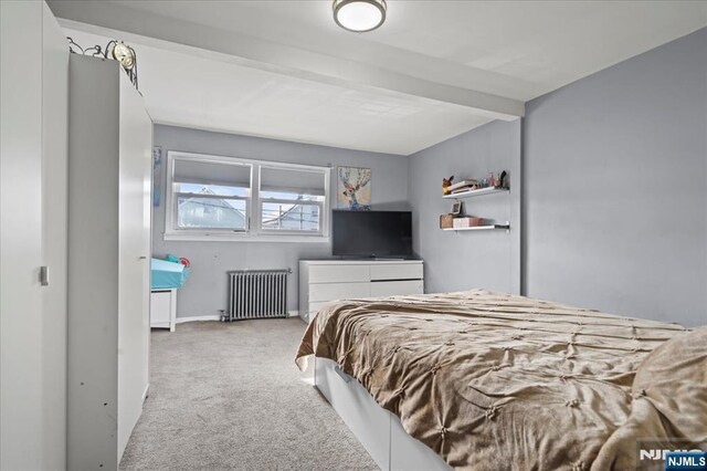 627 Montgomery, Elizabeth, NJ 07202 - carpeted bedroom featuring baseboards, beam ceiling, and radiator heating unit