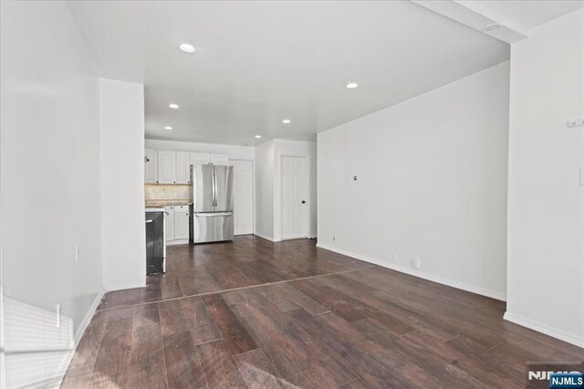 627 Montgomery, Elizabeth, NJ 07202 - unfurnished living room featuring recessed lighting, dark wood-style flooring, and baseboards