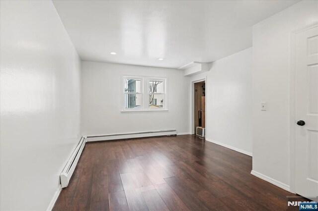 627 Montgomery, Elizabeth, NJ 07202 - empty room featuring baseboards, baseboard heating, and wood finished floors