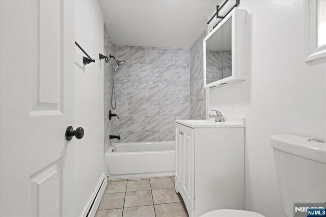 627 Montgomery, Elizabeth, NJ 07202 - bathroom with tile patterned flooring, toilet, baseboard heating, bathing tub / shower combination, and vanity