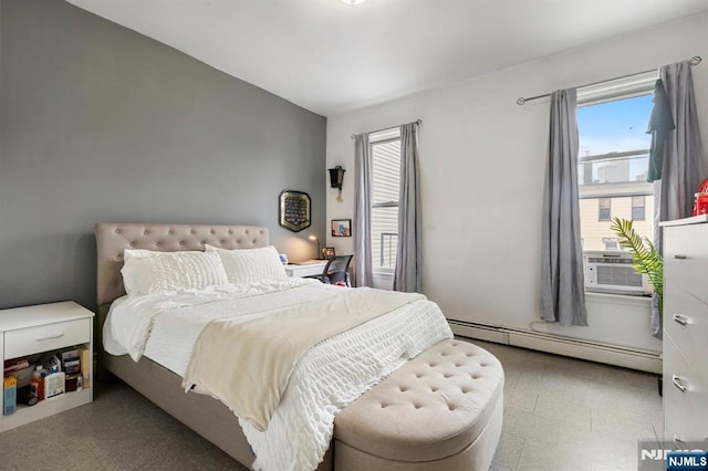 bedroom with tile patterned floors, cooling unit, and baseboard heating