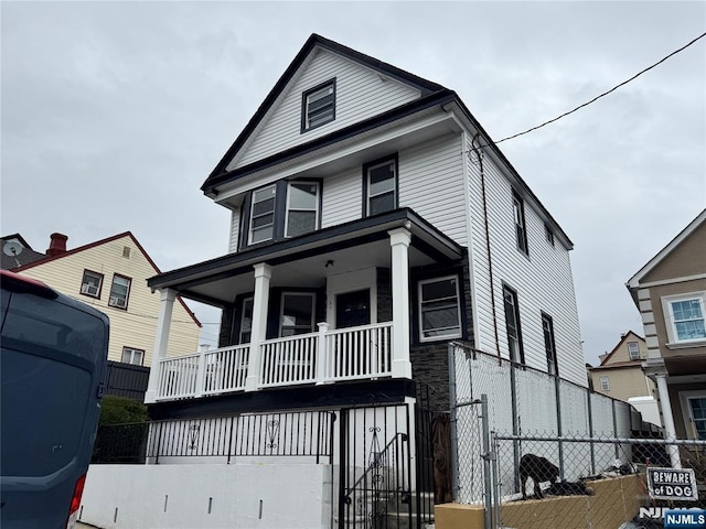 21 Dover St, Paterson, NJ 07501 - american foursquare style home with a porch and fence