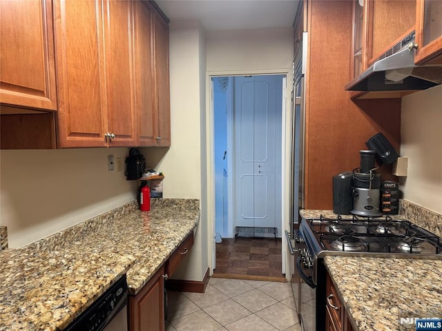 2077 Center Ave Unit 20F, Fort Lee, NJ 07024 - kitchen with black range with gas cooktop, light stone counters, brown cabinets, and under cabinet range hood