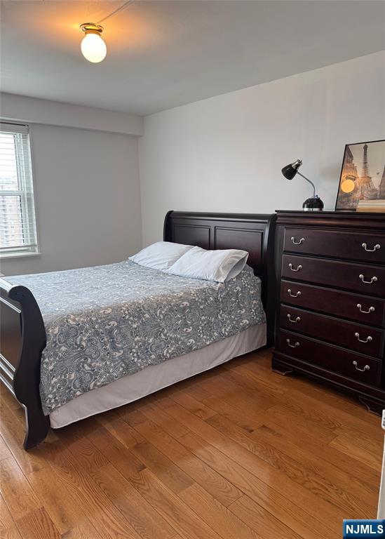 2077 Center Ave Unit 20F, Fort Lee, NJ 07024 - bedroom with wood finished floors