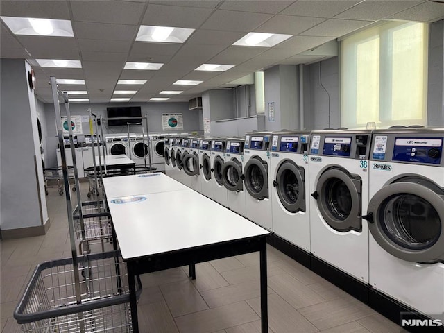 community laundry room with separate washer and dryer