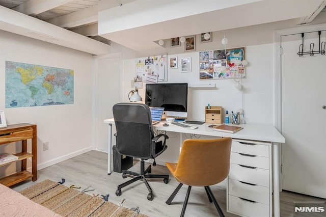 office area with baseboards and light wood-type flooring