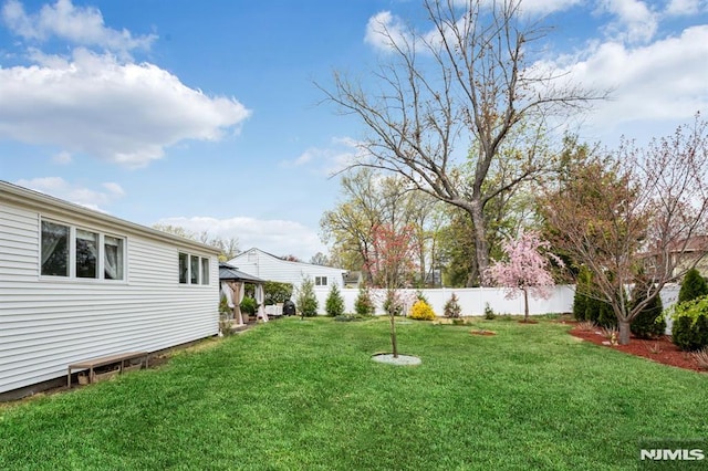 view of yard featuring a gazebo and fence