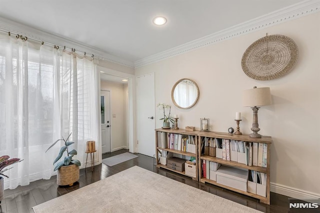 foyer entrance with recessed lighting, ornamental molding, baseboards, and wood finished floors