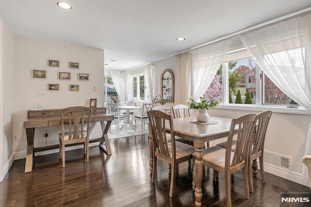 dining space featuring baseboards, dark wood-type flooring, recessed lighting, and visible vents