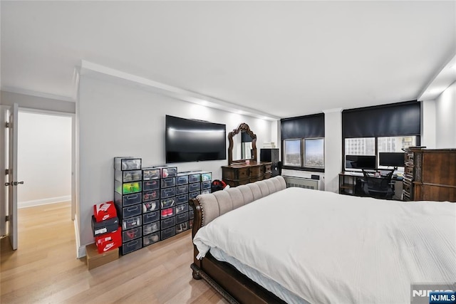 bedroom with light wood-type flooring