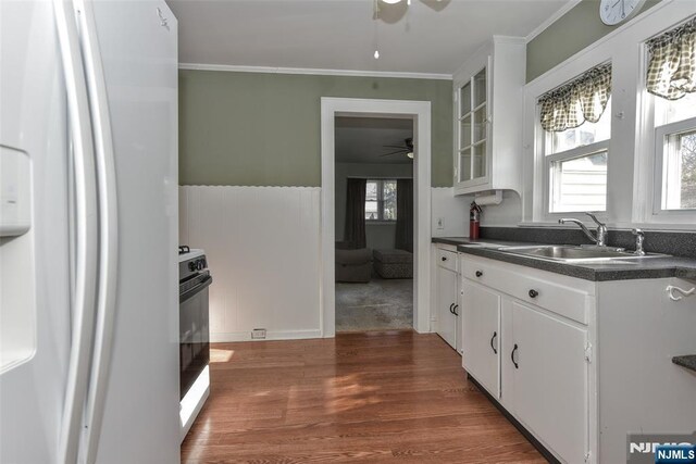 33 Bergen Ave, Waldwick, NJ 07463 - kitchen featuring dark countertops, white refrigerator with ice dispenser, ceiling fan, and a sink