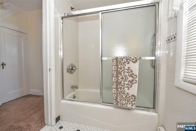 33 Bergen Ave, Waldwick, NJ 07463 - bathroom featuring tile patterned floors, crown molding, and shower / bath combination with glass door