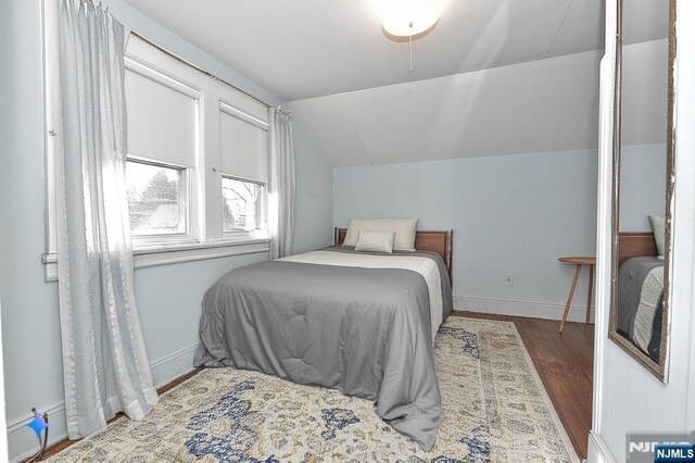 33 Bergen Ave, Waldwick, NJ 07463 - bedroom featuring baseboards, wood finished floors, and vaulted ceiling