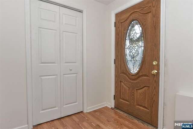 33 Bergen Ave, Waldwick, NJ 07463 - entryway featuring light wood-style flooring and baseboards