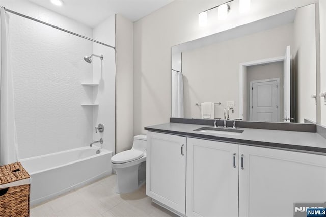 bathroom featuring toilet, shower / tub combo with curtain, and vanity