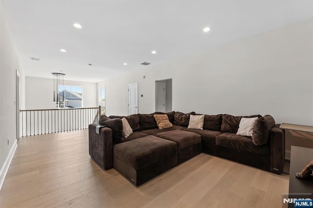 living room featuring visible vents, recessed lighting, and light wood finished floors