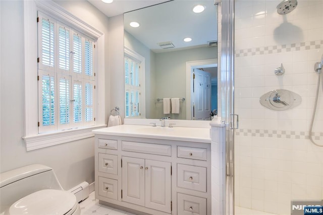 full bath featuring vanity, toilet, baseboard heating, recessed lighting, and a stall shower
