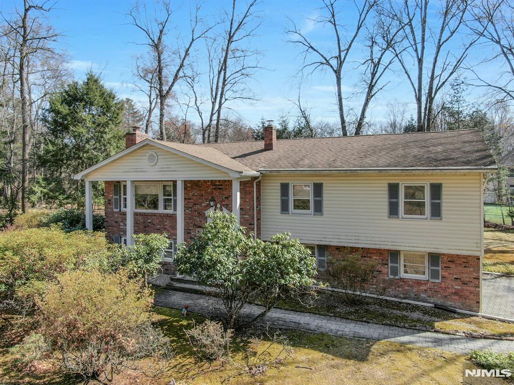 7 Merrywood Ct, Old Tappan, NJ 07675 - view of front of property featuring a chimney and brick siding