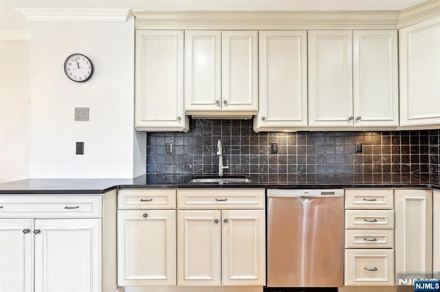 kitchen with dishwasher, a sink, dark countertops, and decorative backsplash