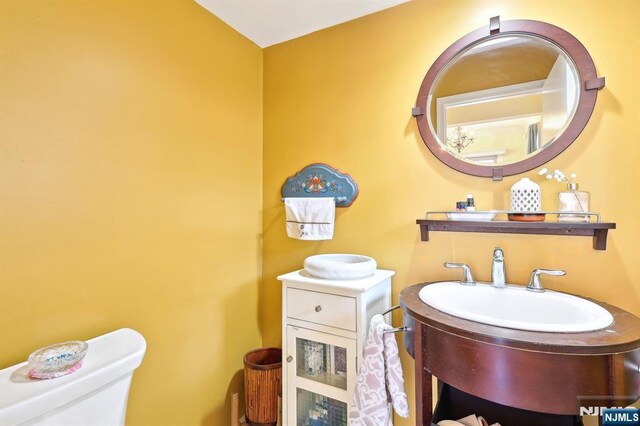 half bathroom featuring toilet