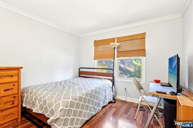 bedroom with hardwood / wood-style flooring, baseboards, and crown molding