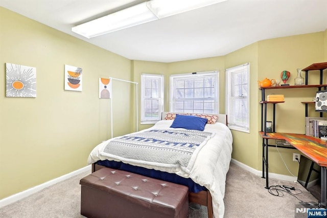 bedroom with carpet flooring and baseboards