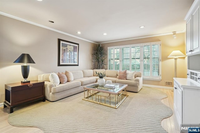 living area with baseboards, ornamental molding, recessed lighting, and light wood-type flooring