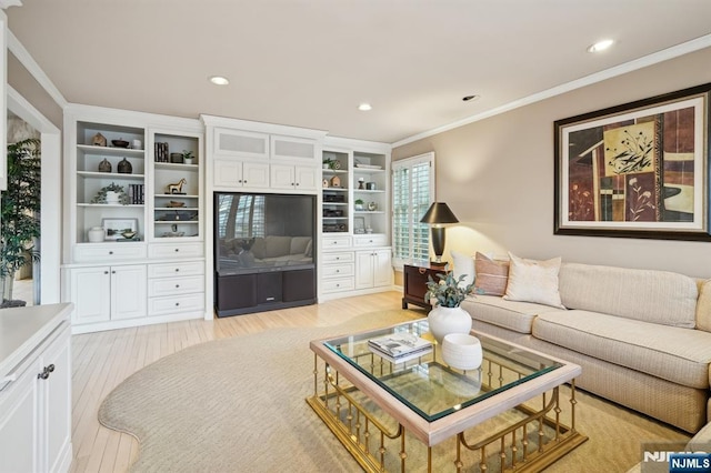 living room featuring light wood finished floors, recessed lighting, and ornamental molding