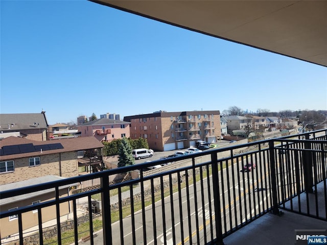 balcony featuring a residential view