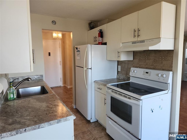 kitchen with decorative backsplash, white appliances, under cabinet range hood, white cabinetry, and a sink