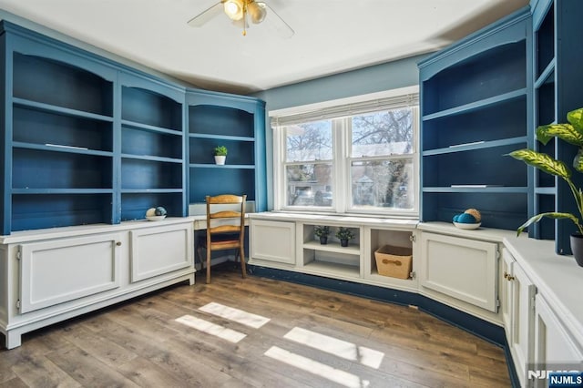 office area with dark wood finished floors and ceiling fan