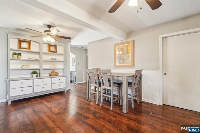 dining room featuring a ceiling fan, dark wood-style floors, beam ceiling, and baseboards