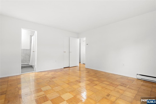74 E Maple St, Teaneck, NJ 07666 - spare room featuring a baseboard radiator and baseboards