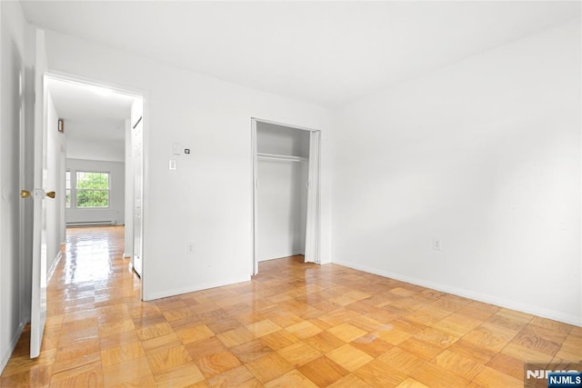 74 E Maple St, Teaneck, NJ 07666 - unfurnished bedroom with a closet and baseboards