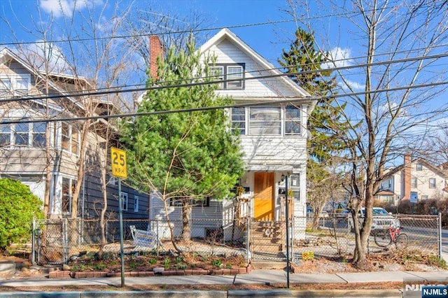 162 Summer St, Orange, NJ 07050 - view of front of property with a gate and a fenced front yard