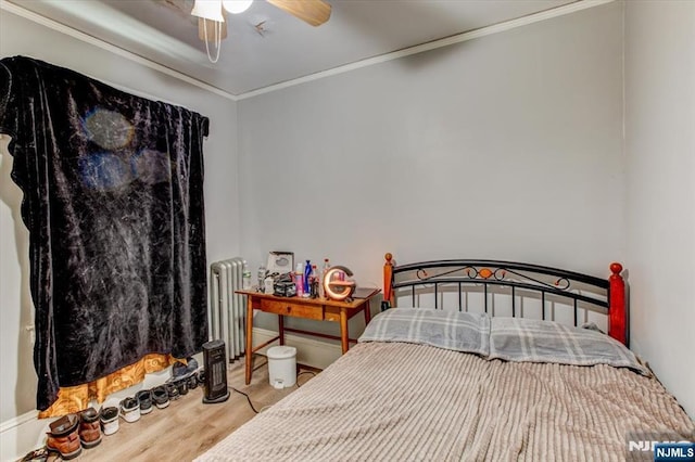 162 Summer St, Orange, NJ 07050 - bedroom with crown molding, radiator heating unit, ceiling fan, and wood finished floors
