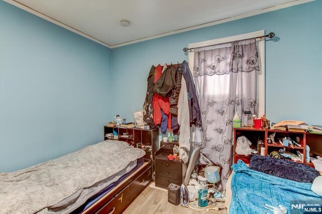 162 Summer St, Orange, NJ 07050 - bedroom featuring crown molding and wood finished floors