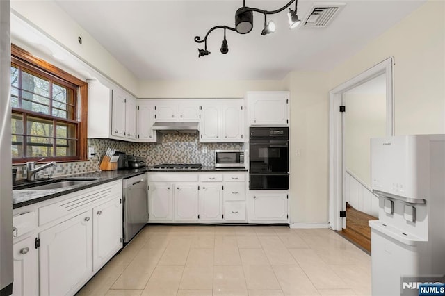 kitchen featuring visible vents, white cabinetry, a sink, appliances with stainless steel finishes, and a warming drawer