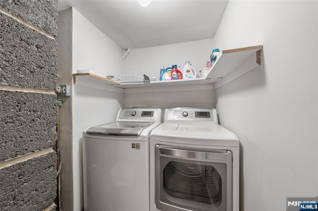 washroom featuring washer and dryer and laundry area