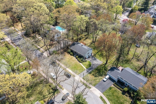 drone / aerial view with a view of trees