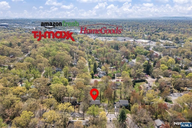 bird's eye view featuring a wooded view