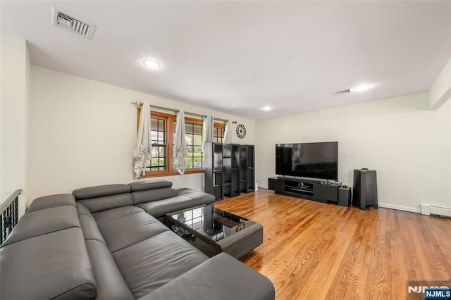 living room featuring visible vents, recessed lighting, baseboards, and wood finished floors