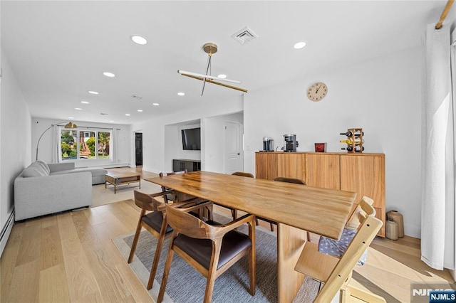 dining space with light wood-style floors, baseboards, recessed lighting, and visible vents