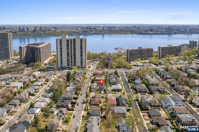 bird's eye view featuring a view of city and a water view