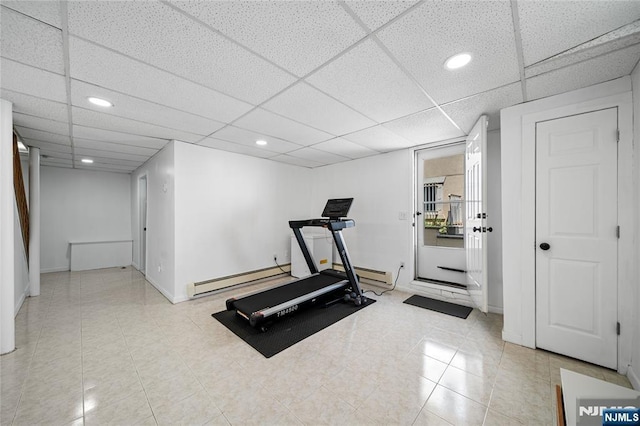 workout room featuring recessed lighting, baseboards, and baseboard heating