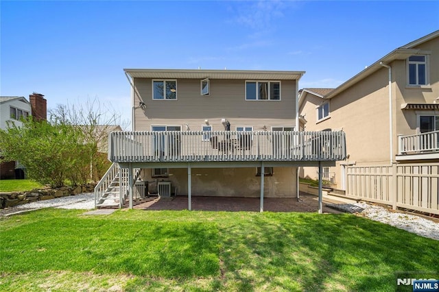 back of house with stairs, central AC, a yard, and a deck
