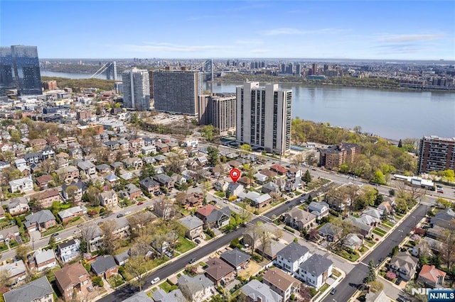 drone / aerial view with a view of city and a water view