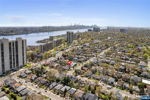 aerial view featuring a city view and a water view